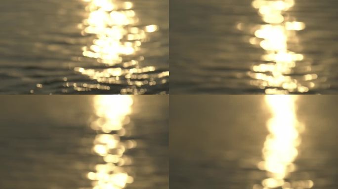 湖岸的景象，前景较低的地方有鹅卵石，反射着太阳