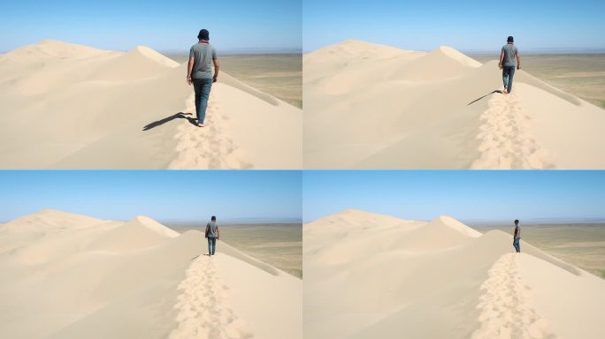 游客在蒙古戈壁沙漠中探索著名的洪多林埃尔斯沙丘