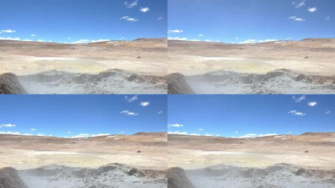 玻利维亚和智利边境沙漠的广角镜头，前景是一个泥泞的火山池。