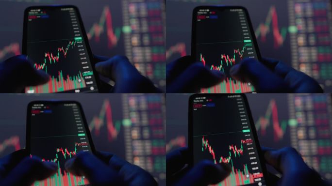 智能手机屏幕上显示着金融市场股票走势的图表。数据分析预测和预测经济增长或衰退和金融危机或发展和成功