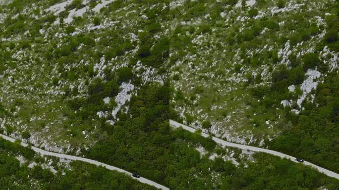 垂直空中无人机追逐跑车山蛇形道路上的科托尔蛇形