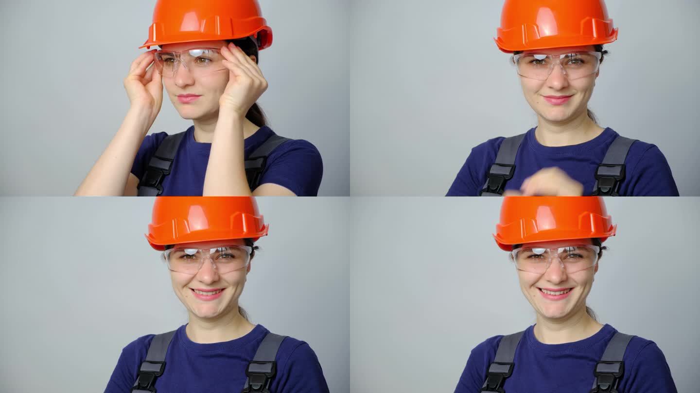 一名身穿工作服、头戴头盔的女工程师戴着白色背景的护目镜。