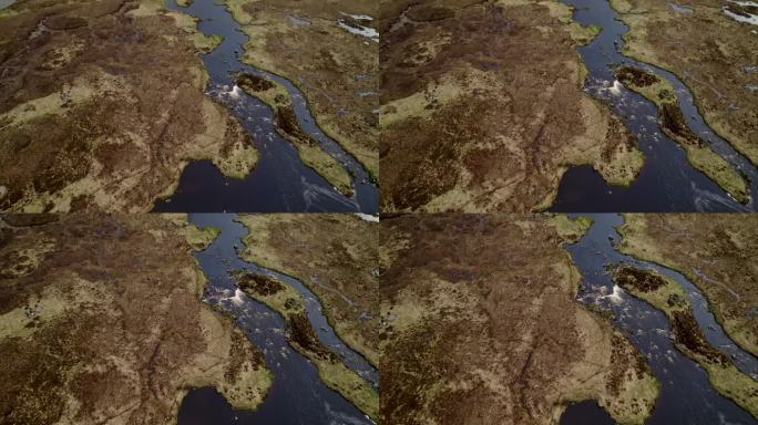 富含矿物质的深色河水流经苏格兰斯凯岛的湿地