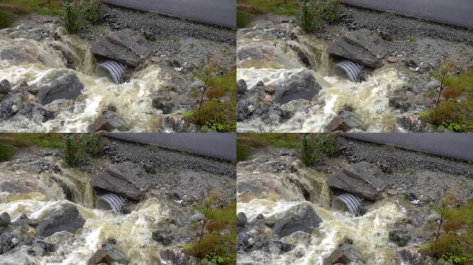 挪威洪水期间，雨水涌入公路下的涵洞。