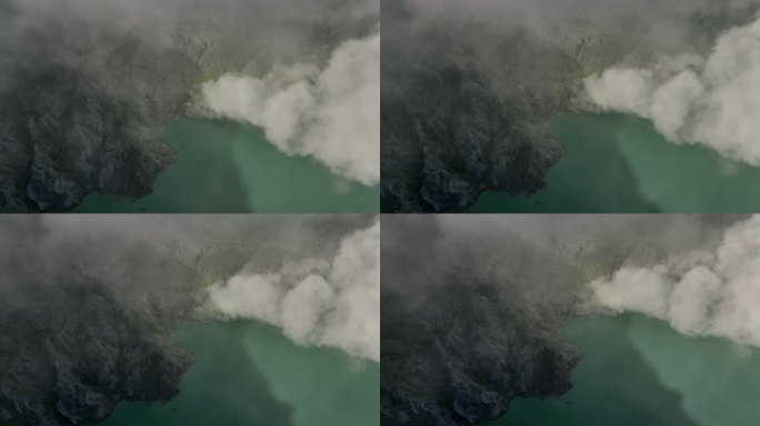 鸟瞰图环绕卡瓦伊真火山，火山口上有烟雾，绿松石湖，印度尼西亚爪哇一座活火山的硫磺开采