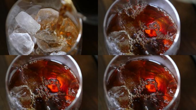冷咖啡。一段将热咖啡倒入加冰的玻璃杯的视频。