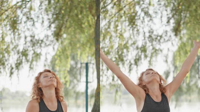 莲花位合十的垂直影像。成年女子坐在湖边，沉浸在冥想中，加深了内心的平静。夏季、秋季和春季是女性在自然