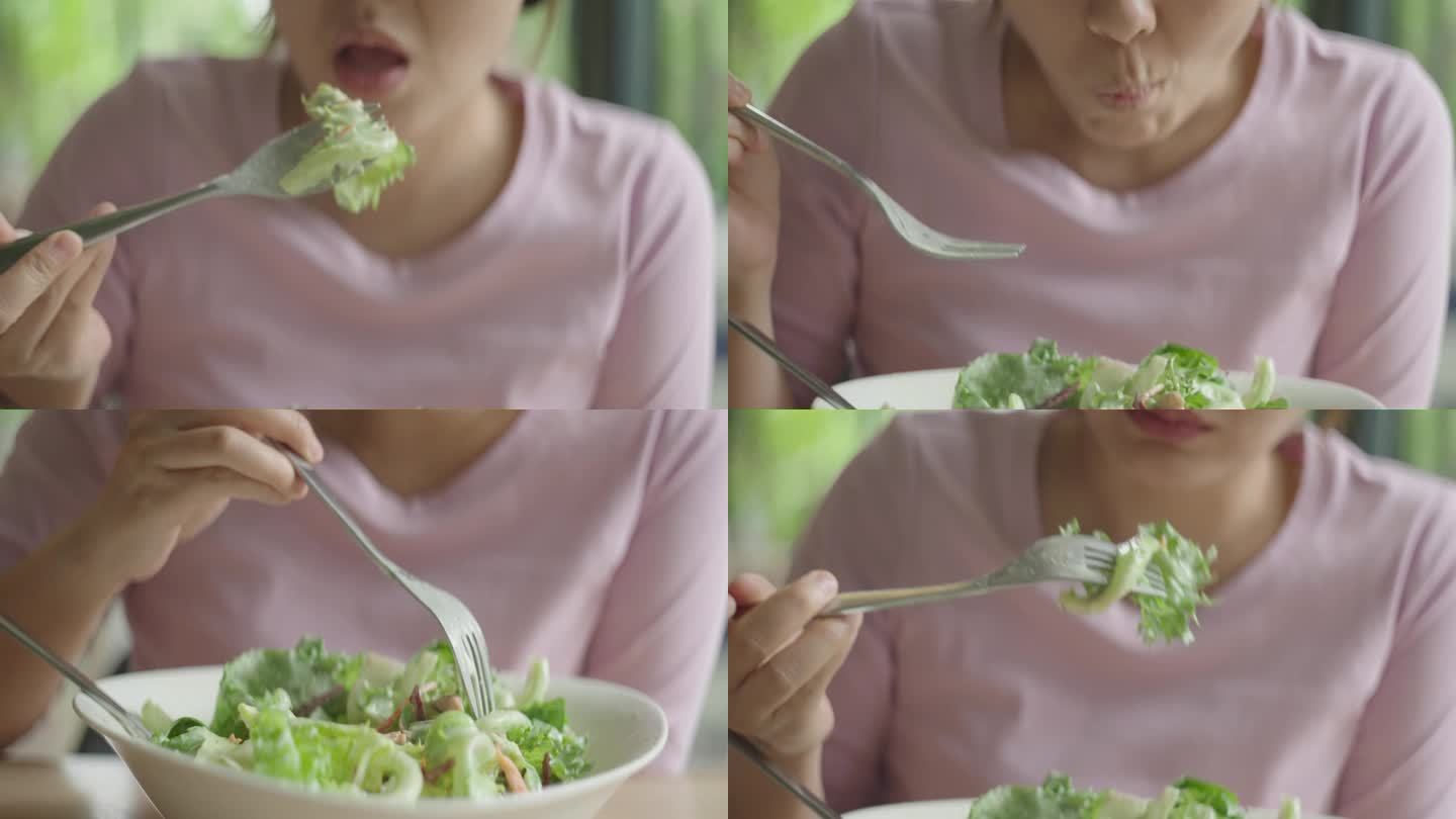 亚洲女人午餐吃希腊沙拉