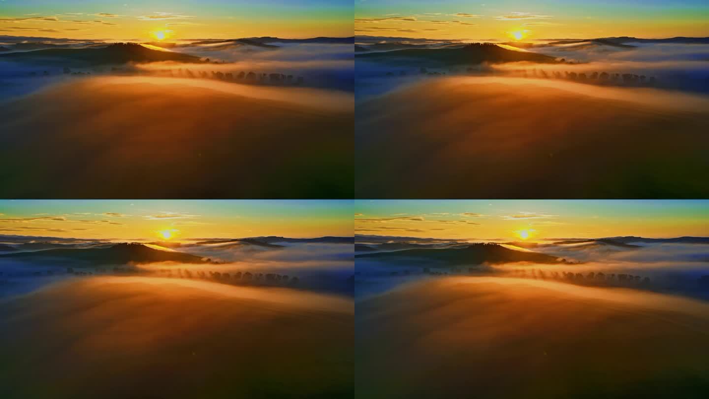 日出在美丽而飘渺的雾霭中。意大利托斯卡纳