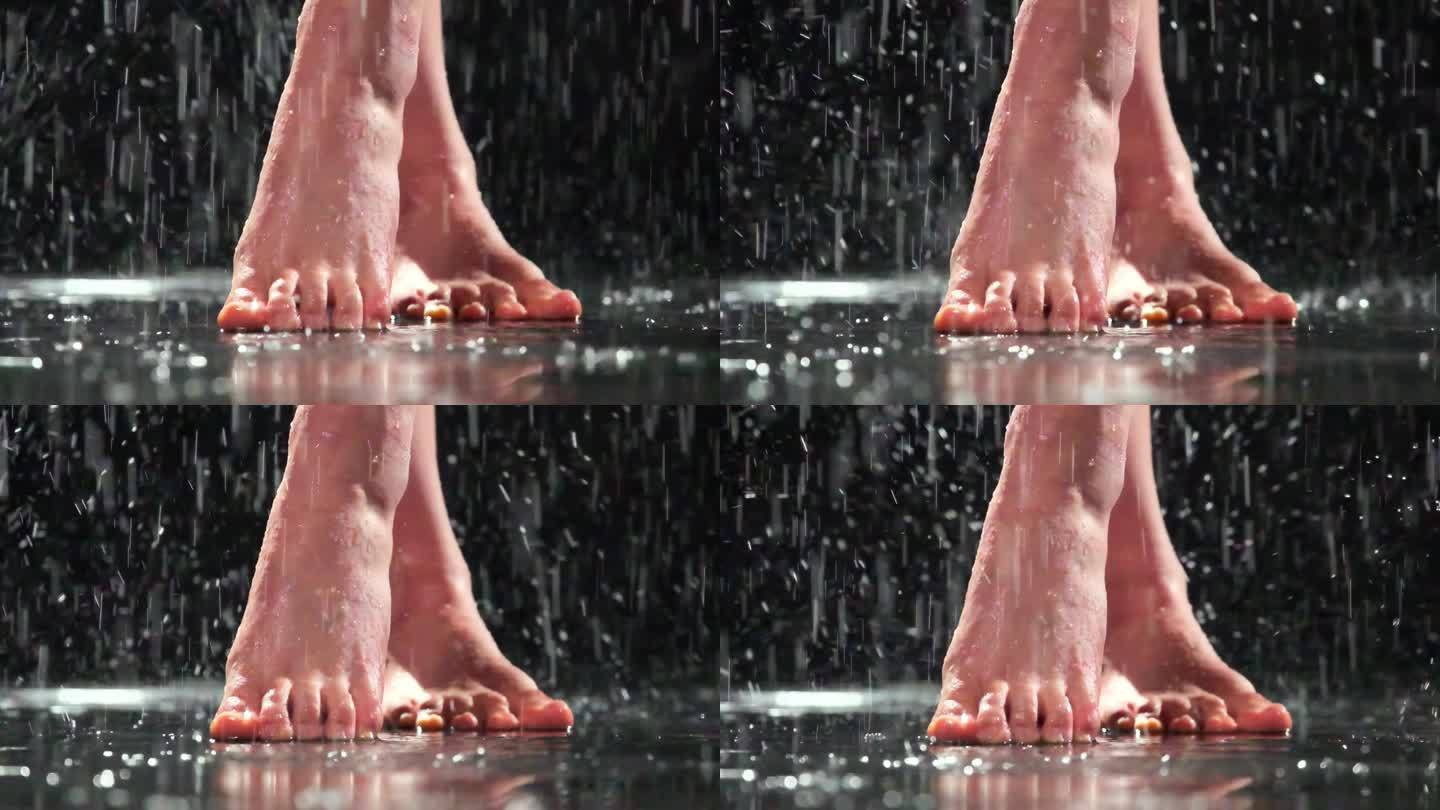 没穿鞋的女人在雨中跷二郎腿踮着脚尖站着