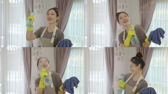 快乐的年轻主妇小三女戴着黄色防护橡胶手套，带着喷雾和抹布，打扫屋子，享受家务，亚洲女佣致力于保持最高