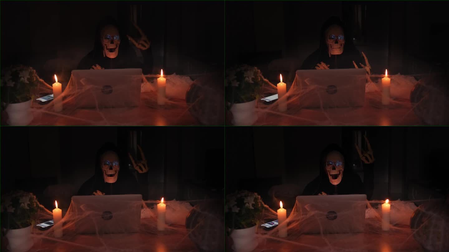 令人毛骨悚然的死亡人物，手提电脑旁边的黑屋子里的骷髅和蜘蛛网里的蜡烛。