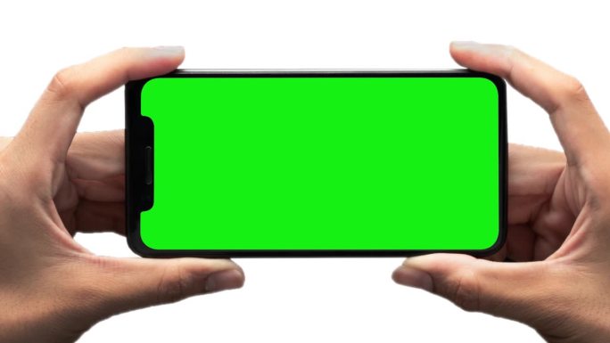 男性手握智能手机模板在白色背景。横屏绿屏手机模型。观看模式。介绍运动