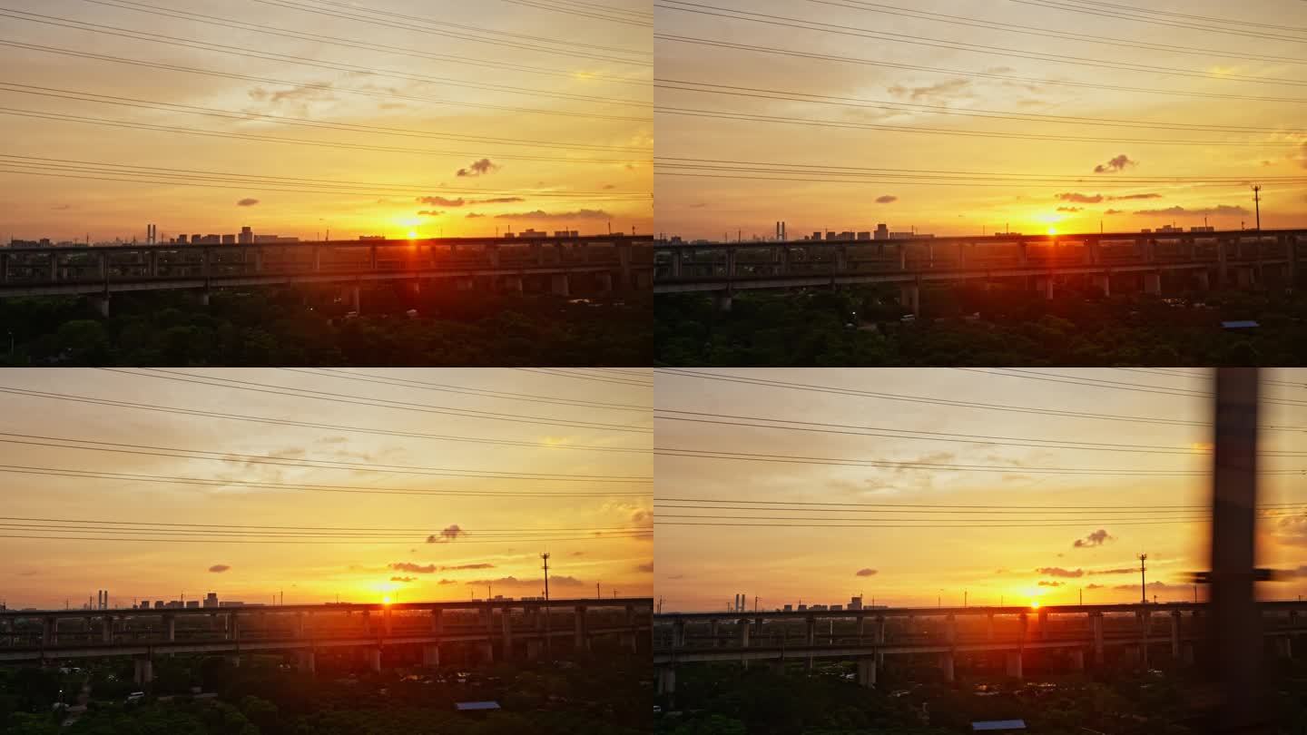 高铁列车窗外的夕阳交错铁路桥