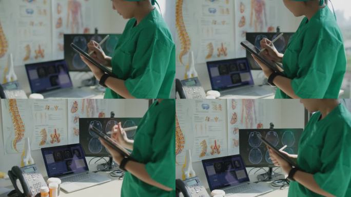 在现代医院里，医生手持并使用数码平板电脑的特写