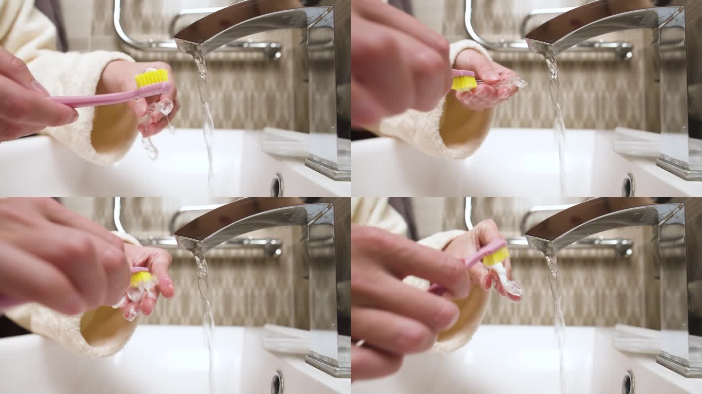 女人们在浴室里用手清洗磨牙的夹板