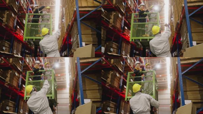 两个仓库工人在叉车上检查制造工厂的货架上的库存纸板造纸厂。