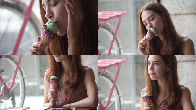 女人吃冰淇淋甜筒巧克力薄荷面带微笑。幸福的女人喜欢用手拿着冰激凌吃甜点。近距离在咖啡馆享受冰淇淋。幸