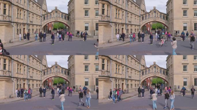 在英国牛津大学新学院巷散步的游客