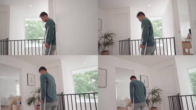 图为一名亚洲男性在事故后接受物理治疗，在家里练习拄着拐杖慢慢走路。治疗后康复，保健。身体残疾的概念，