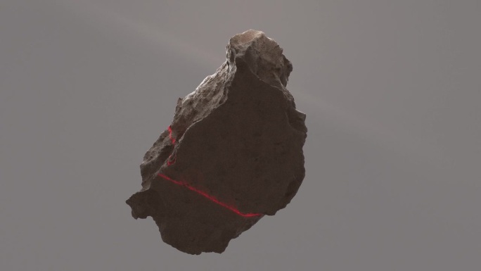 一束红色的激光扫描着一块棕色石头的表面