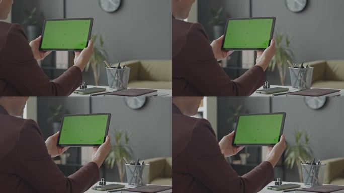 女商人使用带有色度键屏的数字平板电脑