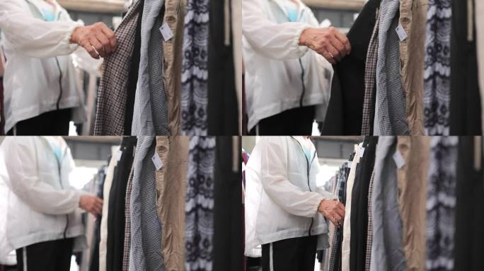 一名妇女在一家时尚零售店疯狂购买衣服