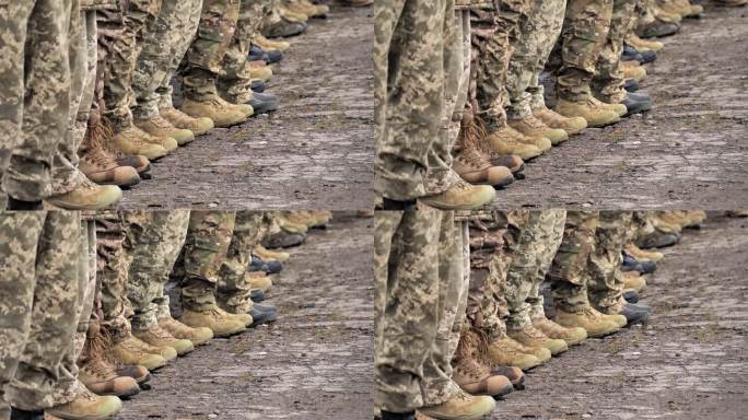 士兵穿靴子的腿和迷彩特写