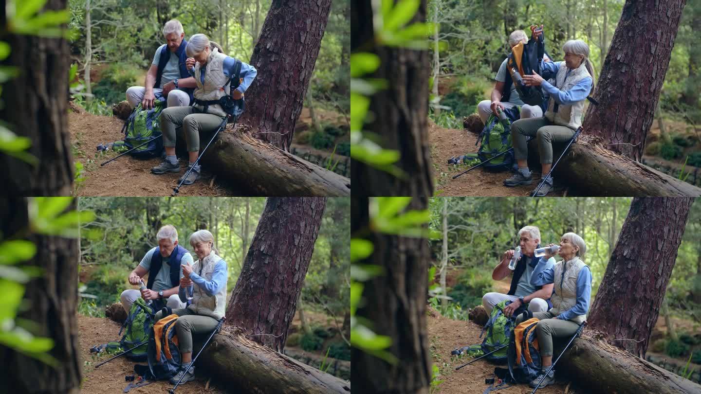 老年人夫妇，在休息、休息或在森林中散步后恢复时，在大自然中远足和喝水。成熟的男人和女人享受徒步探险与