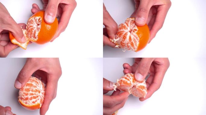一个白色背景下橘子剥皮的4K视频。