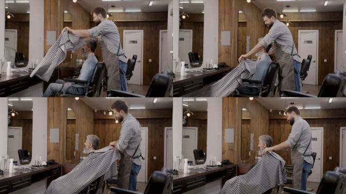 在现代时尚的理发店里，理发师和男顾客一起工作，而成熟的男顾客坐在椅子上对着镜子