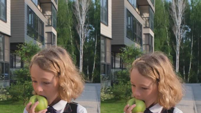 小女孩吃苹果，去上学