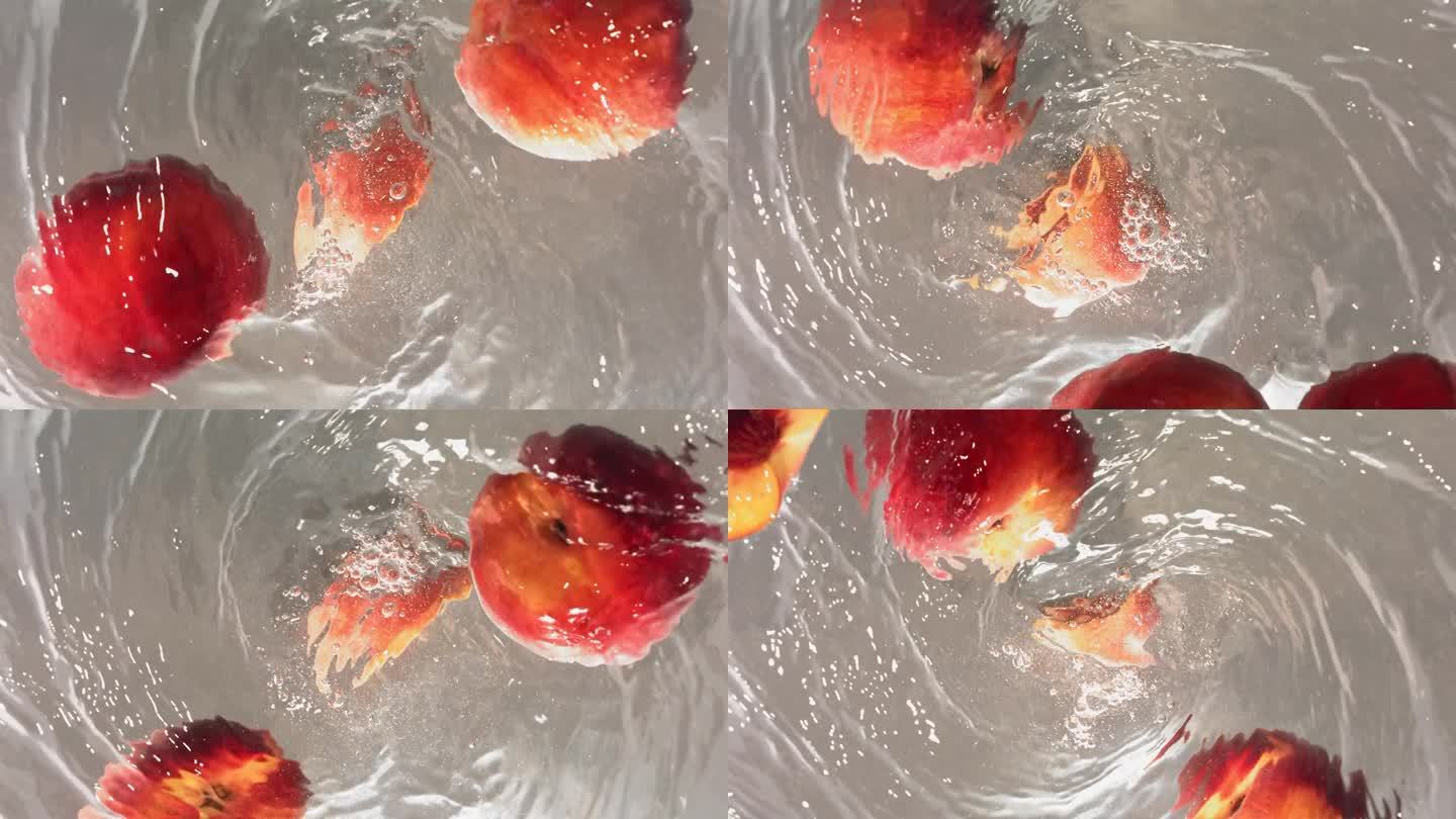 新鲜桃子落入水漩涡的超级慢动作镜头