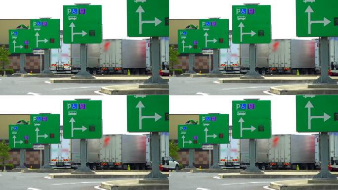 在高速公路服务区的停车场，空置的汽车信息标志和大型卡车