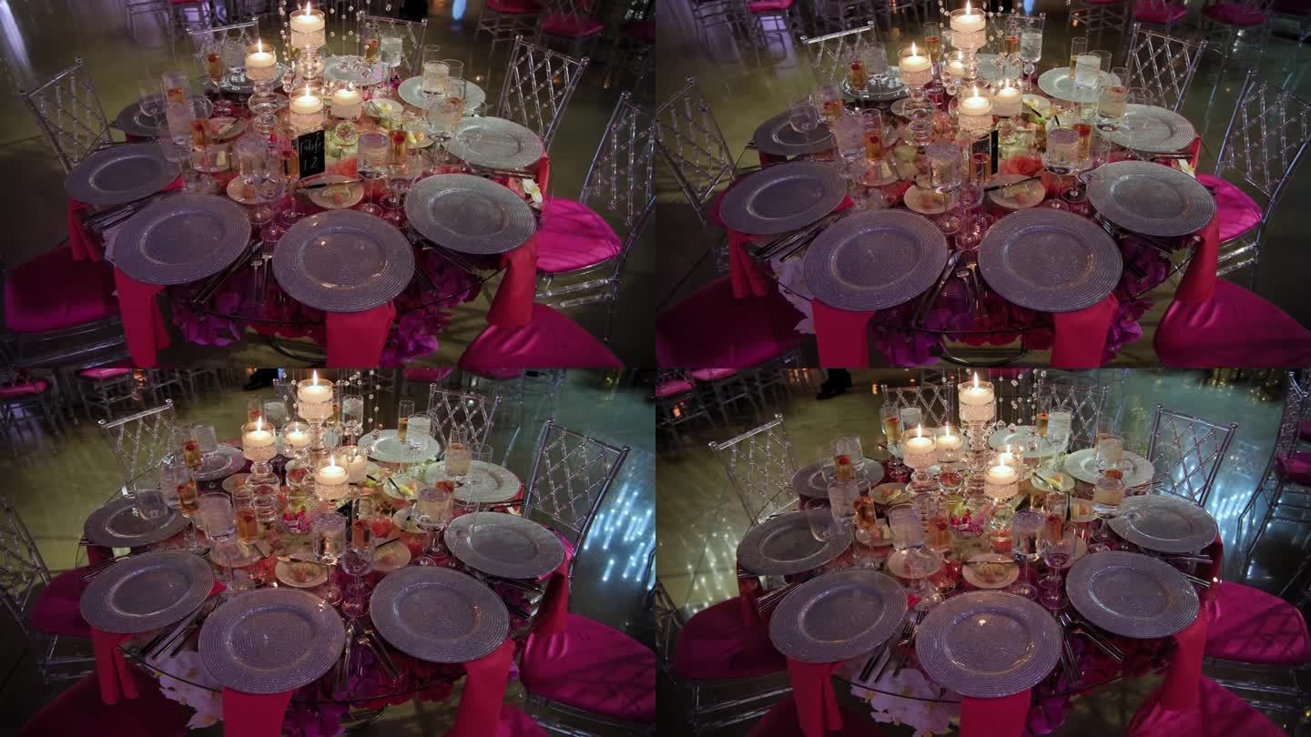 豪华宴会桌的广角镜头设置提供晚餐餐具和银器。移动相机