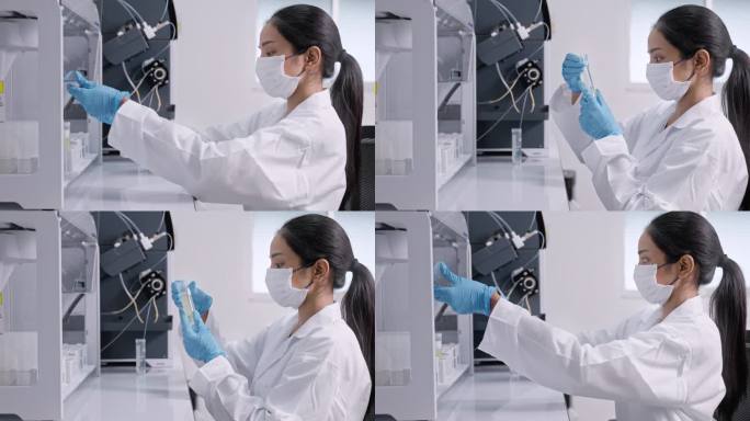 医疗技术人员正在观察显微镜。穿着实验室大褂的科学家在实验室工作。生物技术实验室的科学家检测烧杯中的液