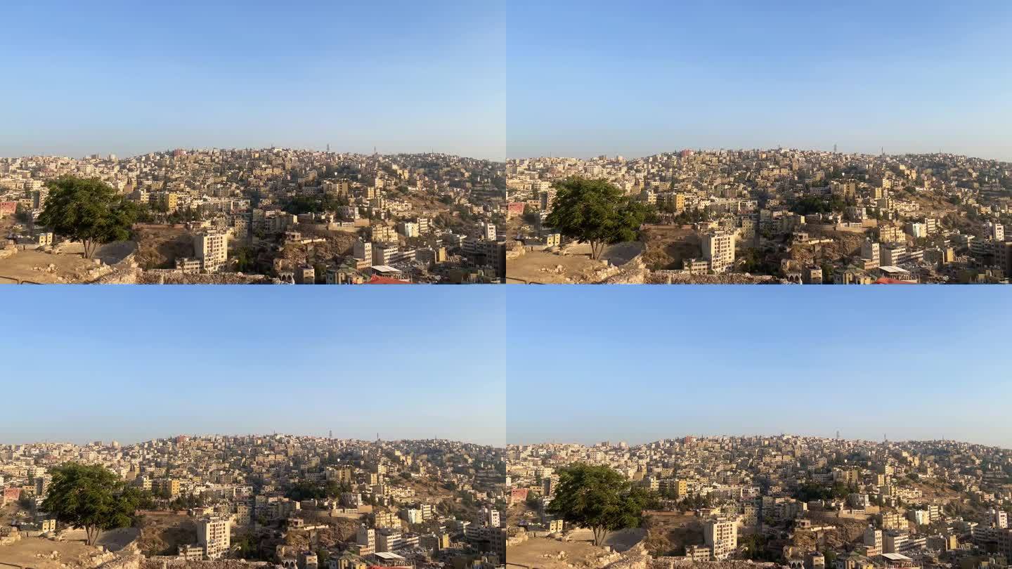 安曼城从安曼城堡与约旦国旗俯瞰美丽的城市在白天4K