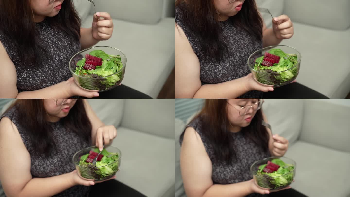 亚洲大体型女性节食减肥吃新鲜自制沙拉健康饮食理念大体型女性减肥饮食生活方式。