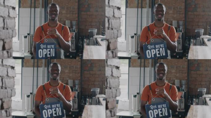 餐厅老板非洲裔美国人改变了关闭到开放的标志广告咖啡馆微笑