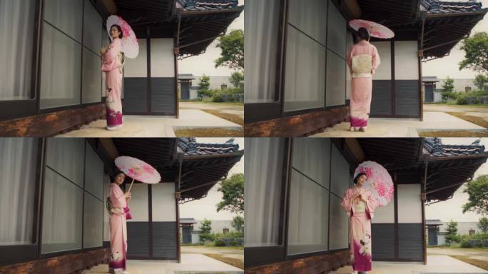 日本女性温柔地看着镜头，温柔地微笑，穿着传统的粉红色和服，拿着一把时髦的雨伞。年轻漂亮的女人在日本的