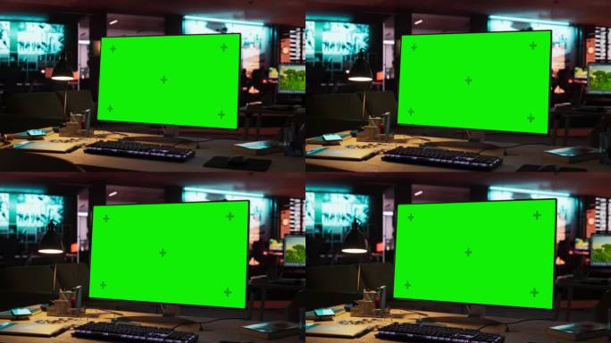 绿屏电脑显示器，立在木桌上，高度可调。游戏开发启动的空装饰创意办公室的色度键显示。放大镜头