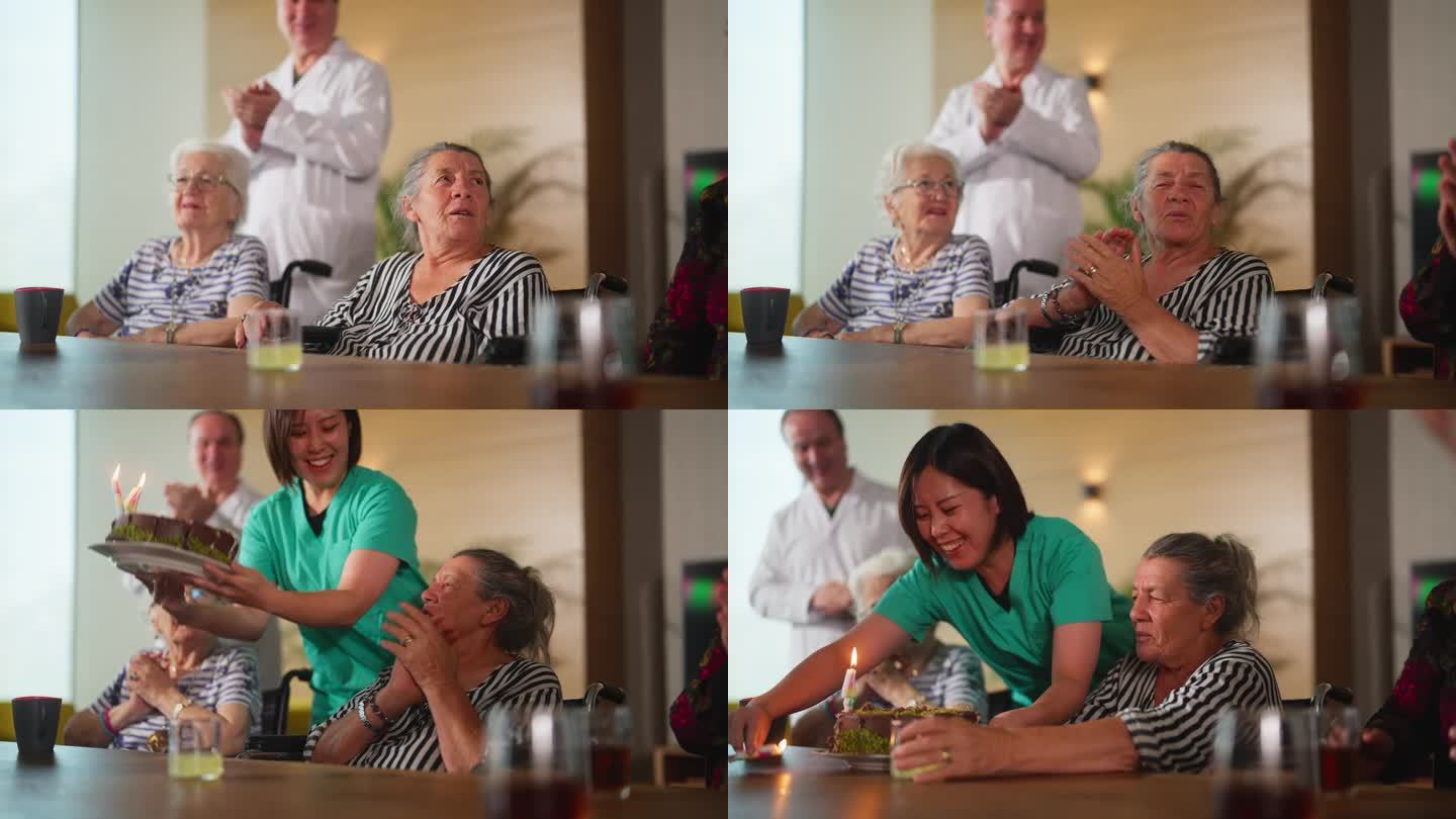 护理院的女护士为年长成年妇女送上生日蛋糕作为惊喜