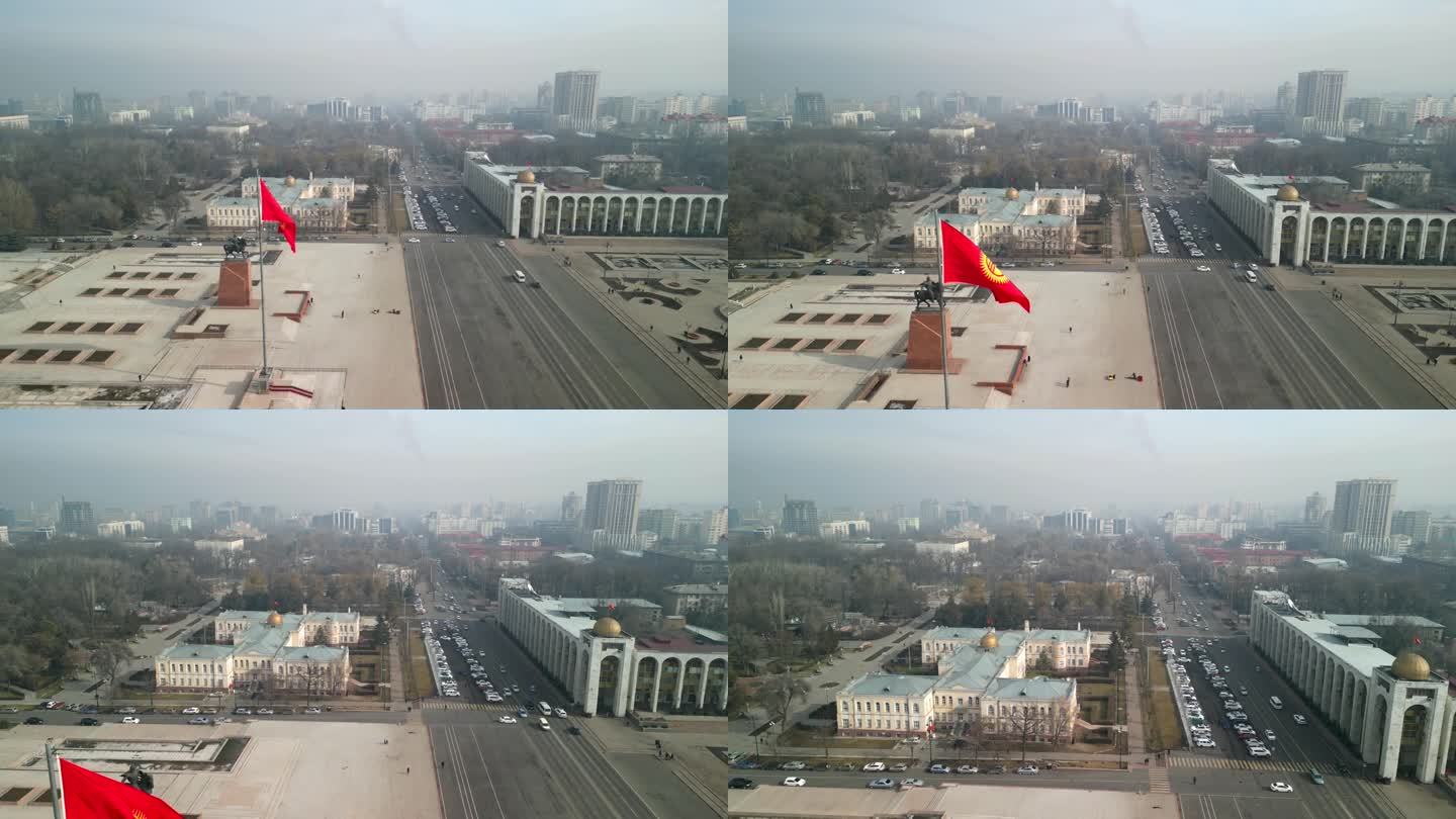 无人机向前飞向吉尔吉斯斯坦国旗和玛纳斯雕像