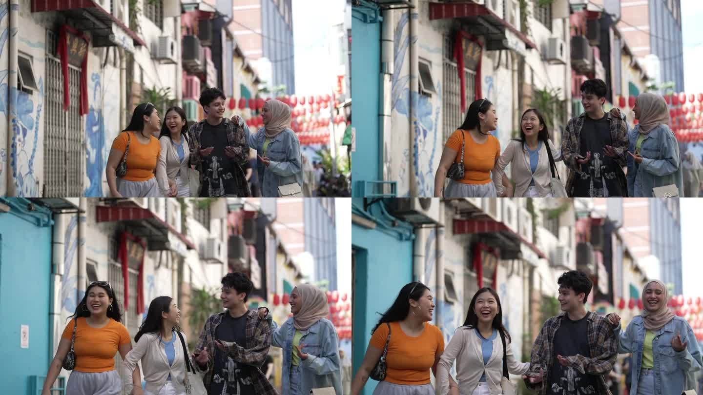 不同种族的亚洲年轻人喜欢一起在城市街道上散步