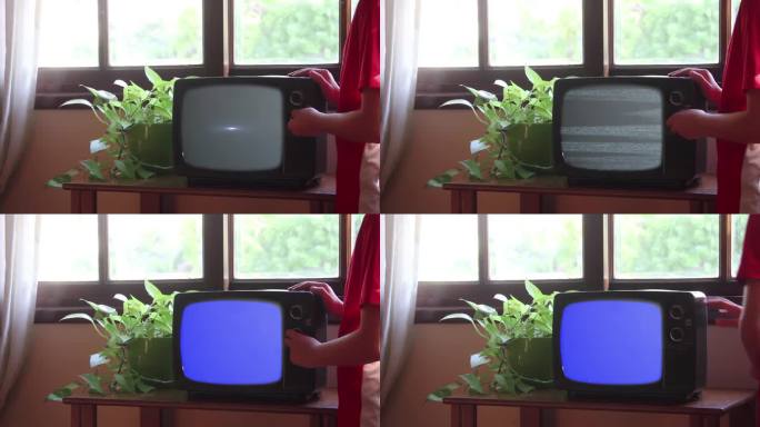 小男孩打开蓝屏复古电视，4K分辨率。