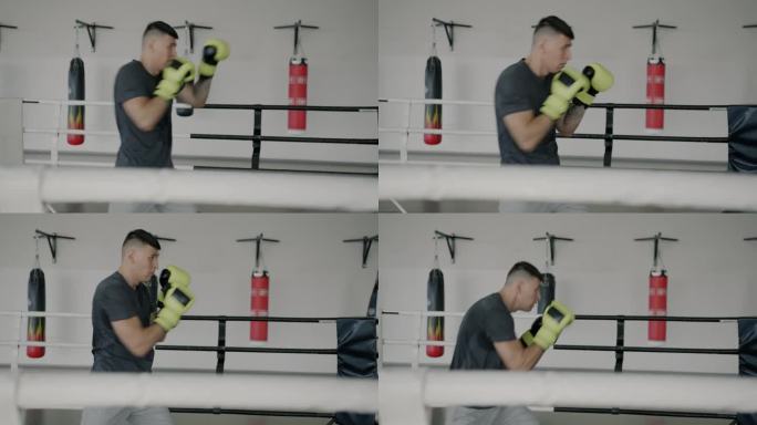 运动中心，戴着拳击手套享受个人训练的斗士在拳击场内移动的慢动作
