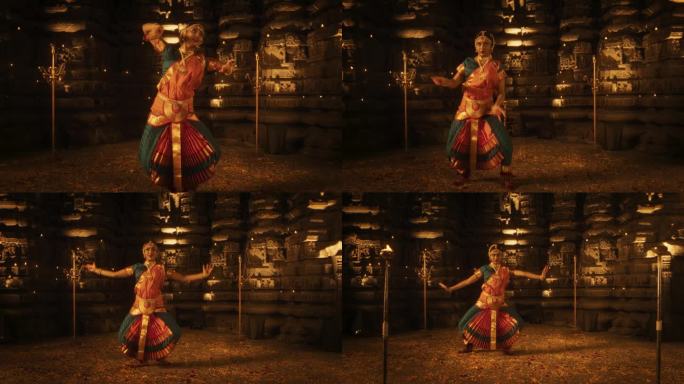 一位富有表现力的年轻印度舞者在一座古老的寺庙里表演民间舞蹈的慢动作肖像。穿着传统服装的妇女穿着五颜六