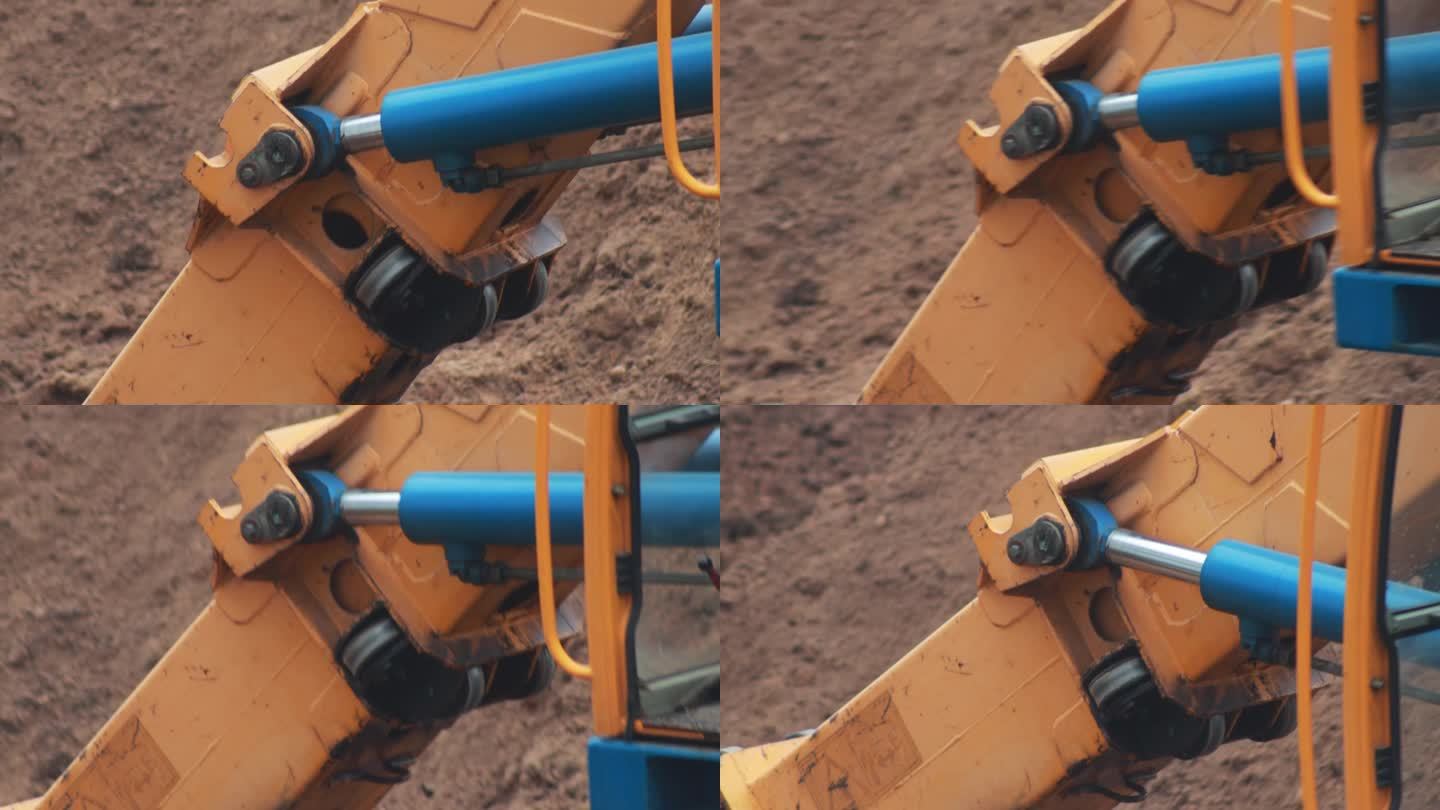 液压缸在挖掘机伸缩臂上的工作，特写。行业