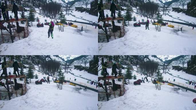 白天，女孩在雪山上做索道滑行冒险