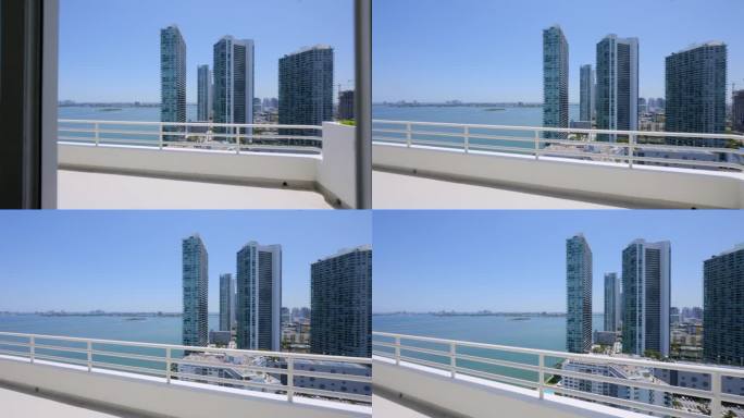在迈阿密海滩的城市摩天大楼和公寓豪华顶层露台壮丽的景色。威尼斯群岛迷人的景色和大西洋的深水